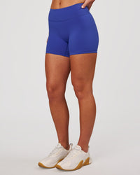 Woman wearing RXD Mid-Rise 4" Short - Power Cobalt | Model:Issy | Size:XS | Thumbnail Index: 5