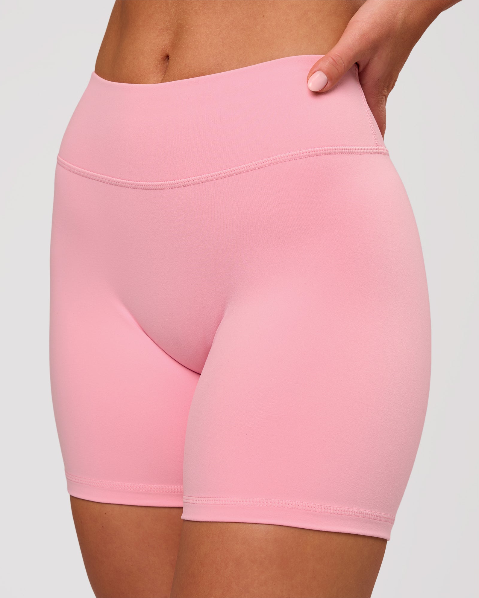 Woman wearing RXD Mid-Rise 6" Short - Pink Rose | Model:Issy | Size:XS