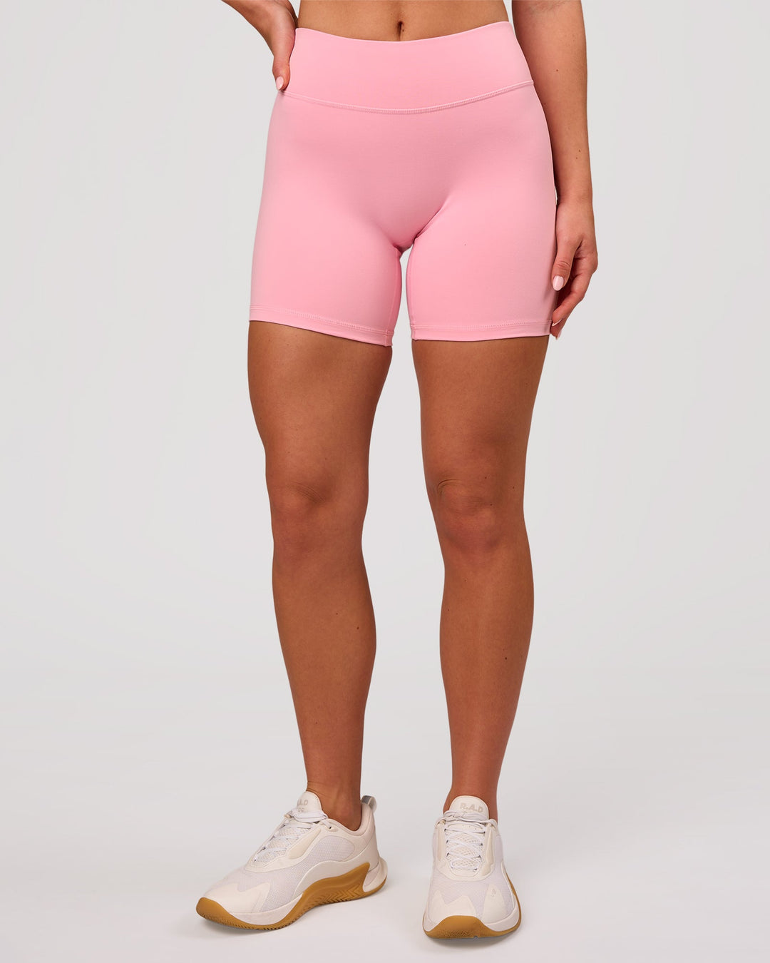 Woman wearing RXD Mid-Rise 6" Short - Pink Rose | Model:Issy | Size:XS - view 4
