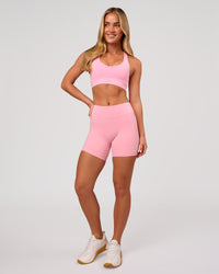 Woman wearing RXD Mid-Rise 6" Short - Pink Rose | Model:Issy | Size:XS | Thumbnail Index: 4