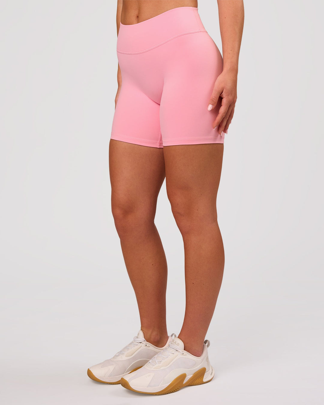 Woman wearing RXD Mid-Rise 6" Short - Pink Rose | Model:Issy | Size:XS - view 6