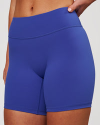 Woman wearing RXD Mid-Rise 6" Short - Power Cobalt | Model:Issy | Size:XS | Thumbnail Index: 0