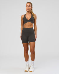 Woman wearing Stamina Sports Bra - Onyx | Model:Issy | Size:XS | Thumbnail Index: 4