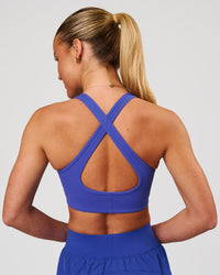 Woman wearing Stamina Sports Bra - Power Cobalt | Model:Issy | Size:XS | Thumbnail Index: 2