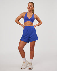 Woman wearing Stamina Sports Bra - Power Cobalt | Model:Issy | Size:XS | Thumbnail Index: 4