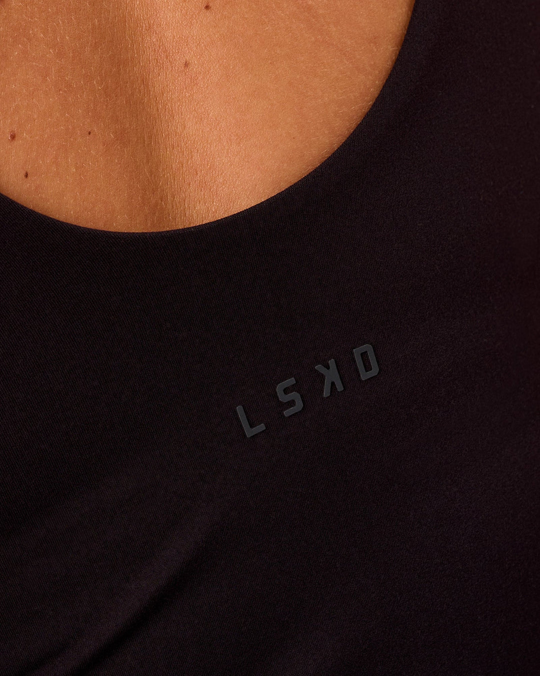 Woman wearing Staple 2.0 Active Shelf Bra Tank - Black | Model:Issy | Size:XS - view 4