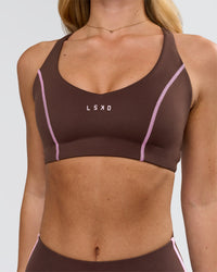 Woman wearing Stellar Sports Bra - Hot Chocolate-Pink Rose | Model:Issy | Size:XS | Thumbnail Index: 1