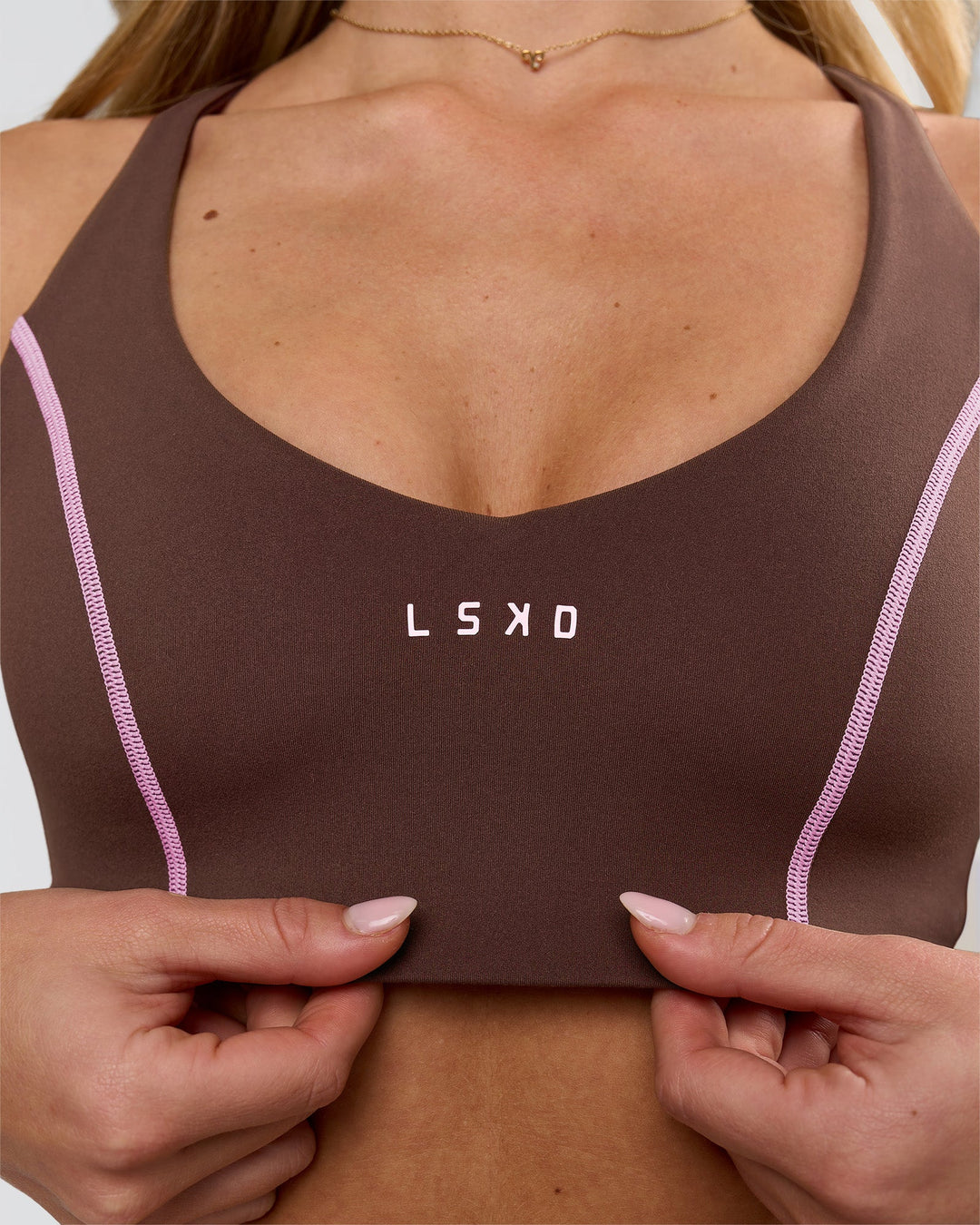 Woman wearing Stellar Sports Bra - Hot Chocolate-Pink Rose | Model:Issy | Size:XS - view 6