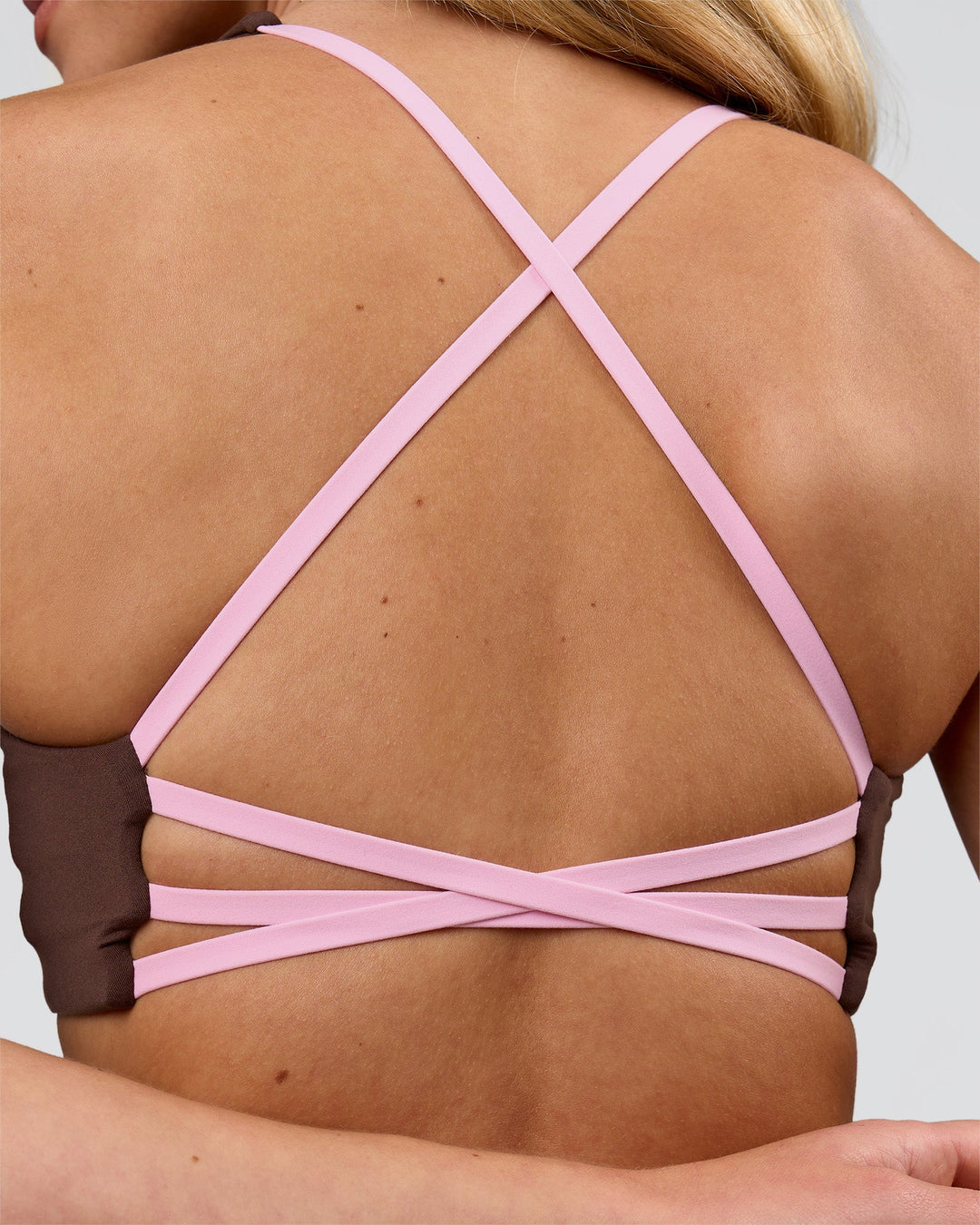 Woman wearing Stellar Sports Bra - Hot Chocolate-Pink Rose | Model:Issy | Size:XS - view 8
