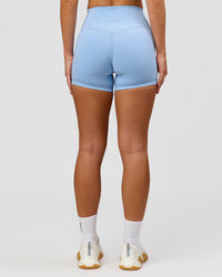 Woman wearing Strong is Beautiful Fusion High-Rise 4" Short - Open Air | Model:Issy | Size:XS | Thumbnail Index: 8