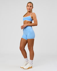 Woman wearing Strong is Beautiful Fusion High-Rise 4" Short - Open Air | Model:Issy | Size:XS | Thumbnail Index: 13