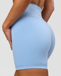 Woman wearing Strong is Beautiful Fusion High-Rise 6" Short - Open Air | Model:Issy | Size:XS | Thumbnail Index: 1