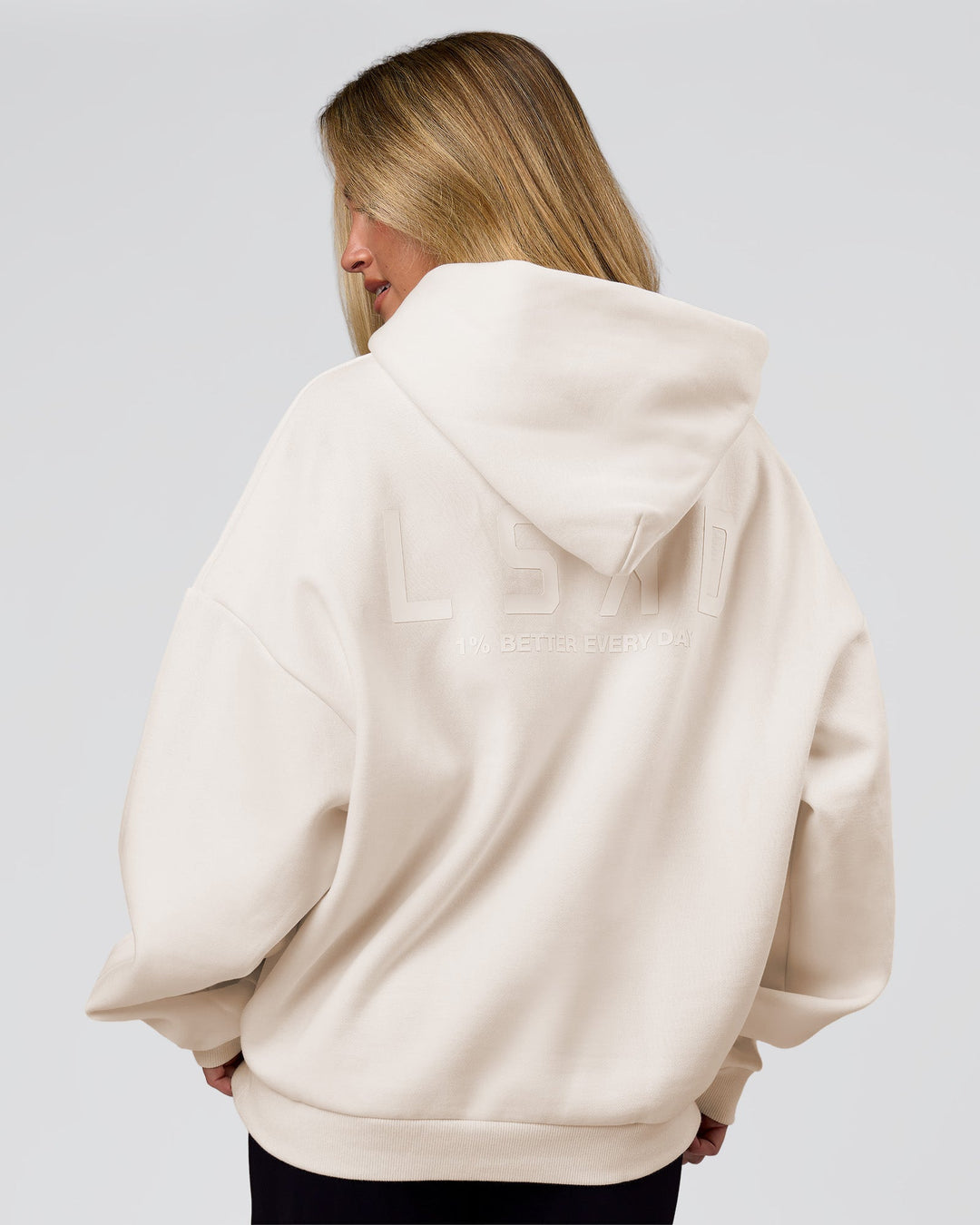 Woman wearing Tonal Legacy Boxy Hoodie - Off White-Off White | Model:Issy | Size:XS - view 3