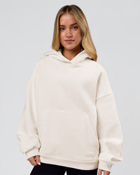 Woman wearing Tonal Legacy Boxy Hoodie - Off White-Off White | Model:Issy | Size:XS | Thumbnail Index: 8