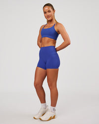 Woman wearing Twist Sports Bra - Power Cobalt | Model:Issy | Size:XS | Thumbnail Index: 3