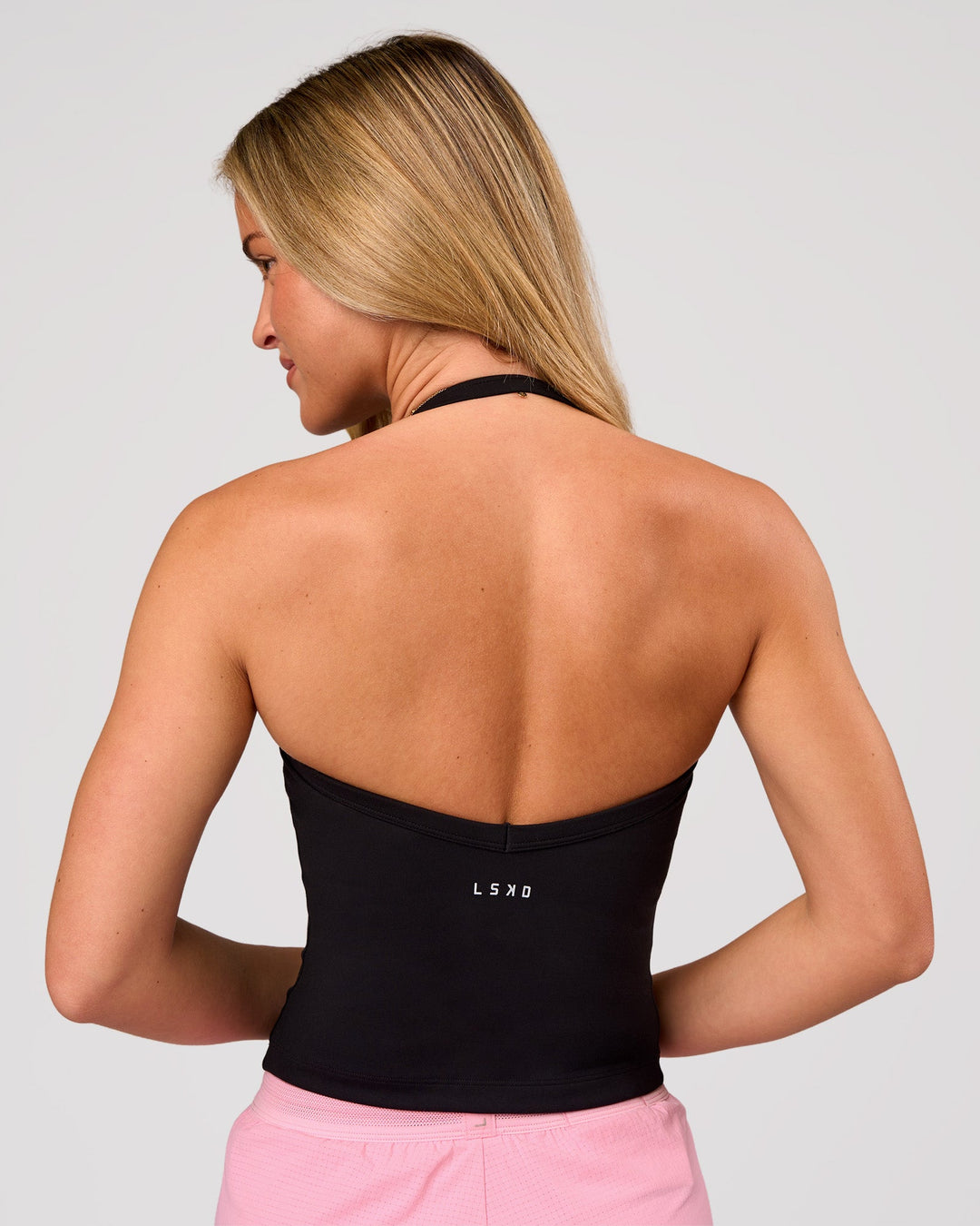 Woman wearing Unleash Shelf Bra Tank - Black | Model:Issy | Size:XS - view 2
