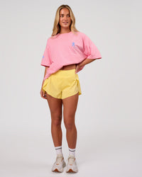 Woman wearing Values Manifesto Heavyweight Oversized Tee  - Pink Rose-Open Air | Model:Issy | Size:XS | Thumbnail Index: 7