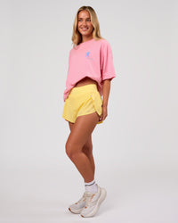 Woman wearing Values Manifesto Heavyweight Oversized Tee  - Pink Rose-Open Air | Model:Issy | Size:XS | Thumbnail Index: 9