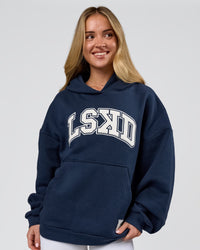 Woman wearing Varsity Boxy Hoodie - Future Navy-White | Model:Issy | Size:XS | Thumbnail Index: 13