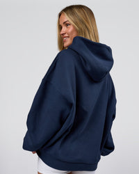 Woman wearing Varsity Boxy Hoodie - Future Navy-White | Model:Issy | Size:XS | Thumbnail Index: 14