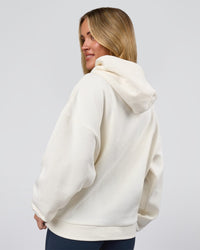 Woman wearing Varsity Boxy Hoodie - Off White-Pink Rose | Model:Issy | Size:XS | Thumbnail Index: 12