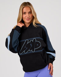 Woman wearing Vibe Oversized Hoodie - Black-Future Navy | Model:Issy | Size:XS | Thumbnail Index: 2
