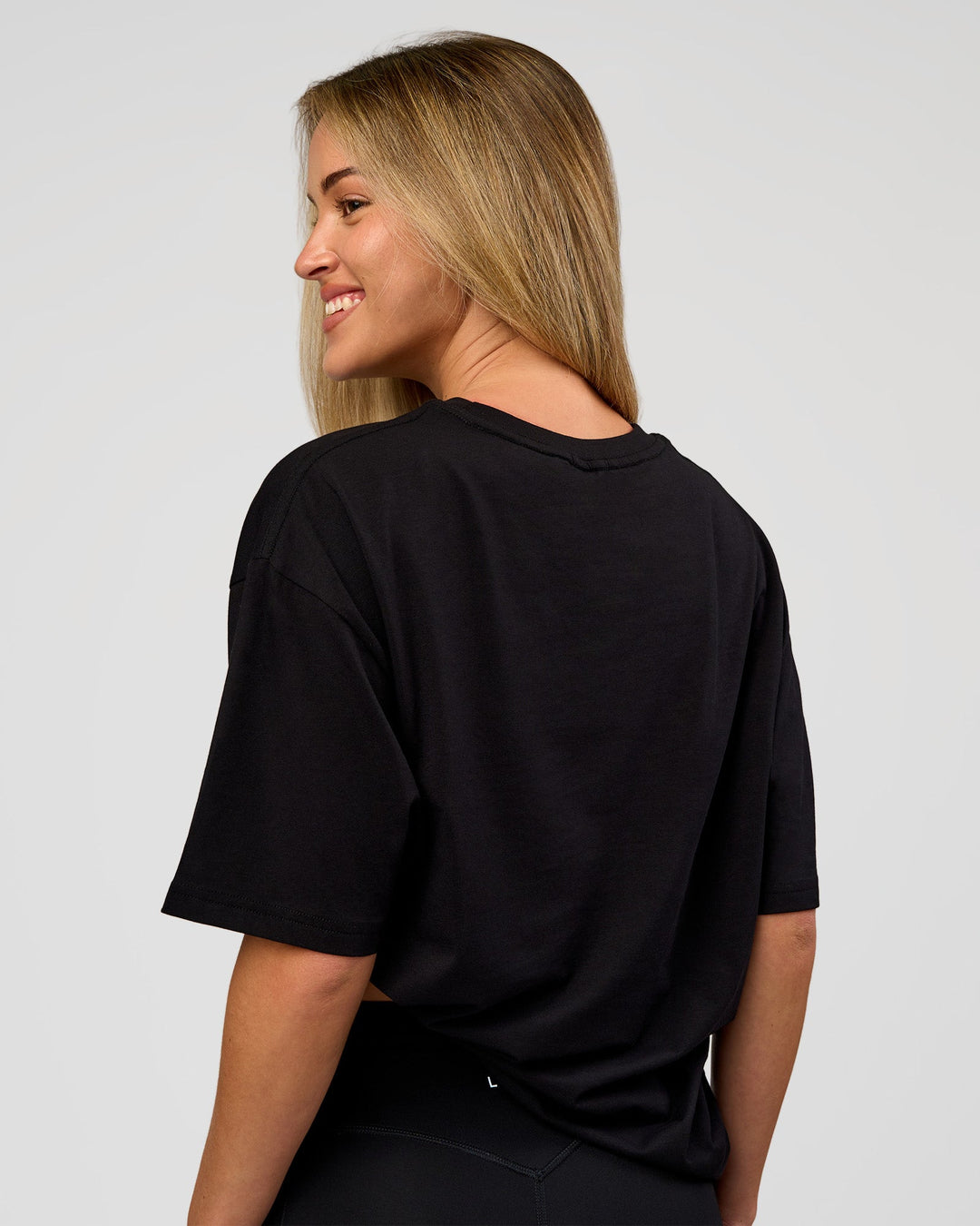 Woman wearing VS1 Enjoy The Journey FLXCotton Oversize Tee - Black | Model:Issy | Size:XS - view 5