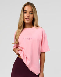 Woman wearing VS1 Enjoy The Journey FLXCotton Oversize Tee - Pink Rose | Model:Issy | Size:XS | Thumbnail Index: 2