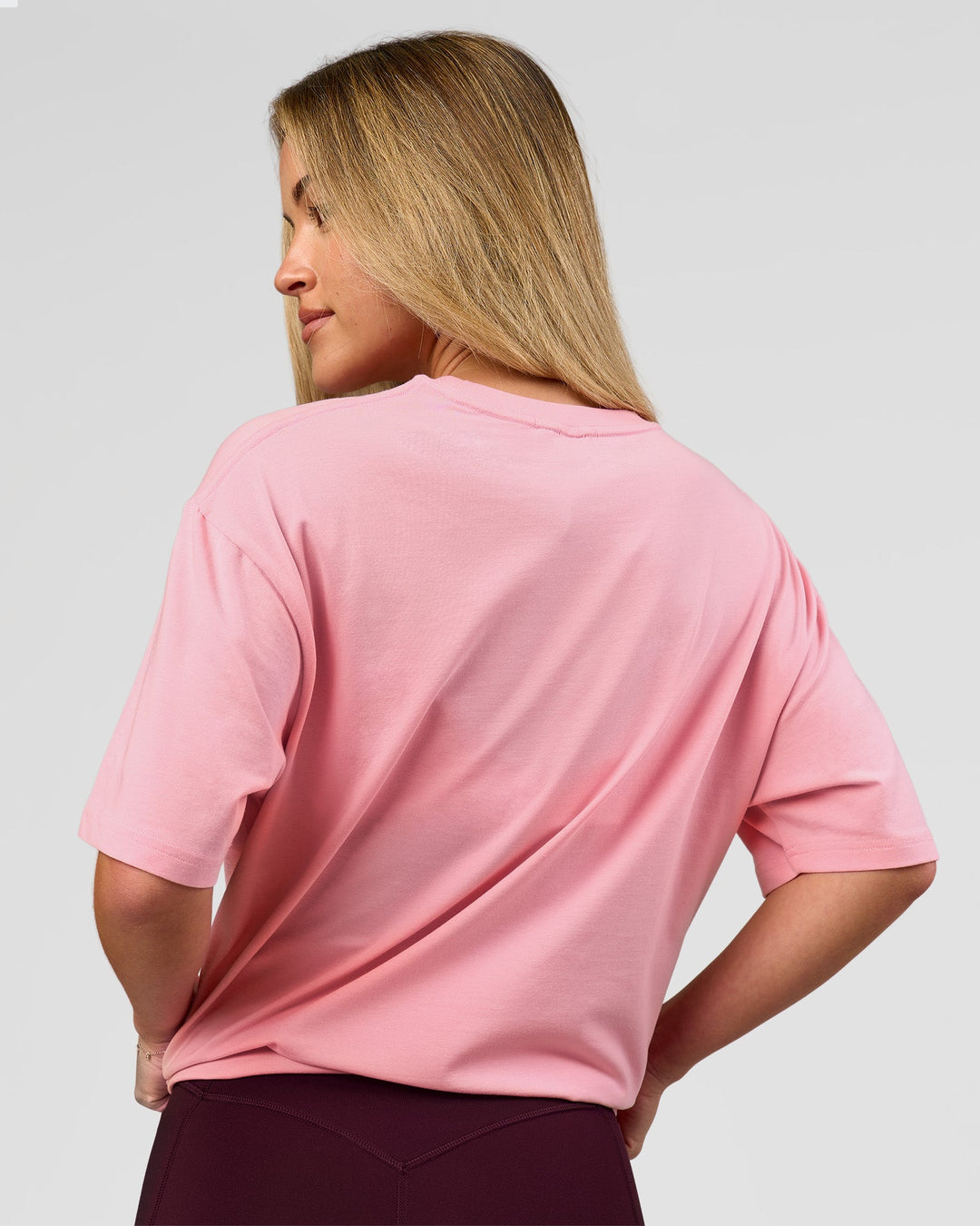 Woman wearing VS1 Enjoy The Journey FLXCotton Oversize Tee - Pink Rose | Model:Issy | Size:XS - view 7