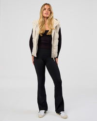 Woman wearing Go-To Puffer Vest - Shale Beige | Model:Izzy | Size:XS