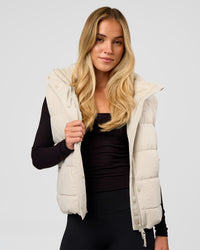 Woman wearing Go-To Puffer Vest - Shale Beige | Model:Izzy | Size:XS