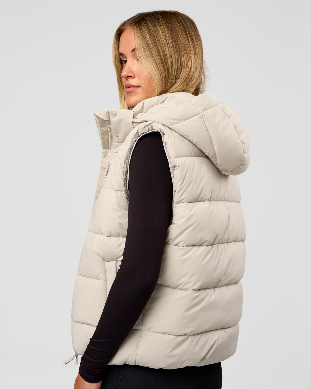 Woman wearing Go-To Puffer Vest - Shale Beige | Model:Izzy | Size:XS
