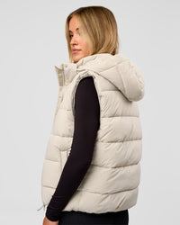 Woman wearing Go-To Puffer Vest - Shale Beige | Model:Izzy | Size:XS
