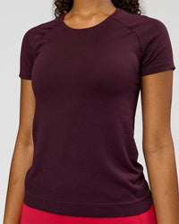 Woman wearing AeroFLX+ Seamless Tee - Cherry Lacquer/Cherry Lacquer | Model:Jordan | Size:XS | Thumbnail Index: 2