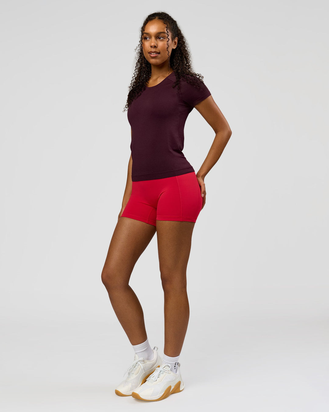 Woman wearing AeroFLX+ Seamless Tee - Cherry Lacquer/Cherry Lacquer | Model:Jordan | Size:XS - view 5