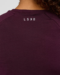 Woman wearing AeroFLX+ Seamless Tee - Cherry Lacquer/Cherry Lacquer | Model:Jordan | Size:XS | Thumbnail Index: 5