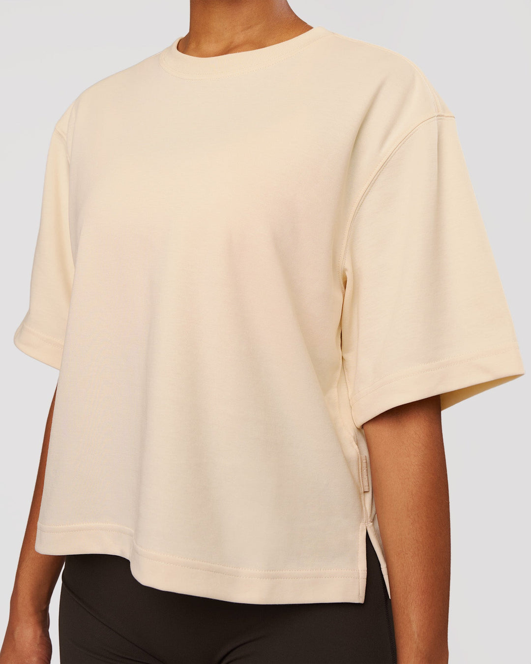 Woman wearing AfterDark ZeroCrease Cropped Tee - Vanilla Bean | Model:Jordan | Size:XS - view 2