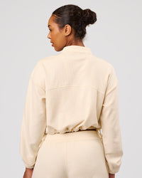 Woman wearing CloudWaffle Midi Zip Up - Vanilla Bean | Model:Jordan | Size:XS | Thumbnail Index: 5