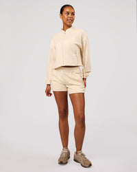 Woman wearing CloudWaffle Midi Zip Up - Vanilla Bean | Model:Jordan | Size:XS | Thumbnail Index: 6