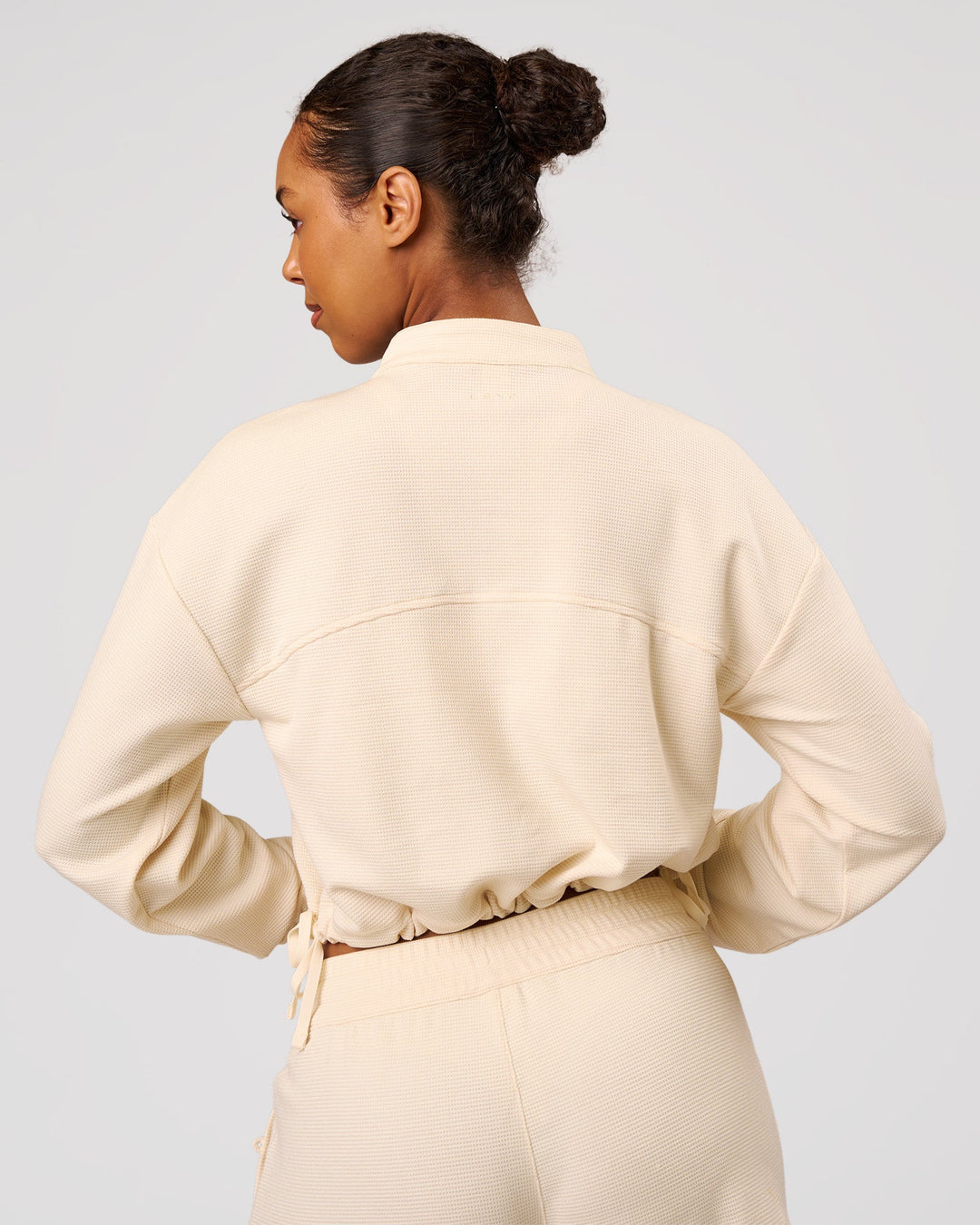 Woman wearing CloudWaffle Midi Zip Up - Vanilla Bean | Model:Jordan | Size:XS - view 8