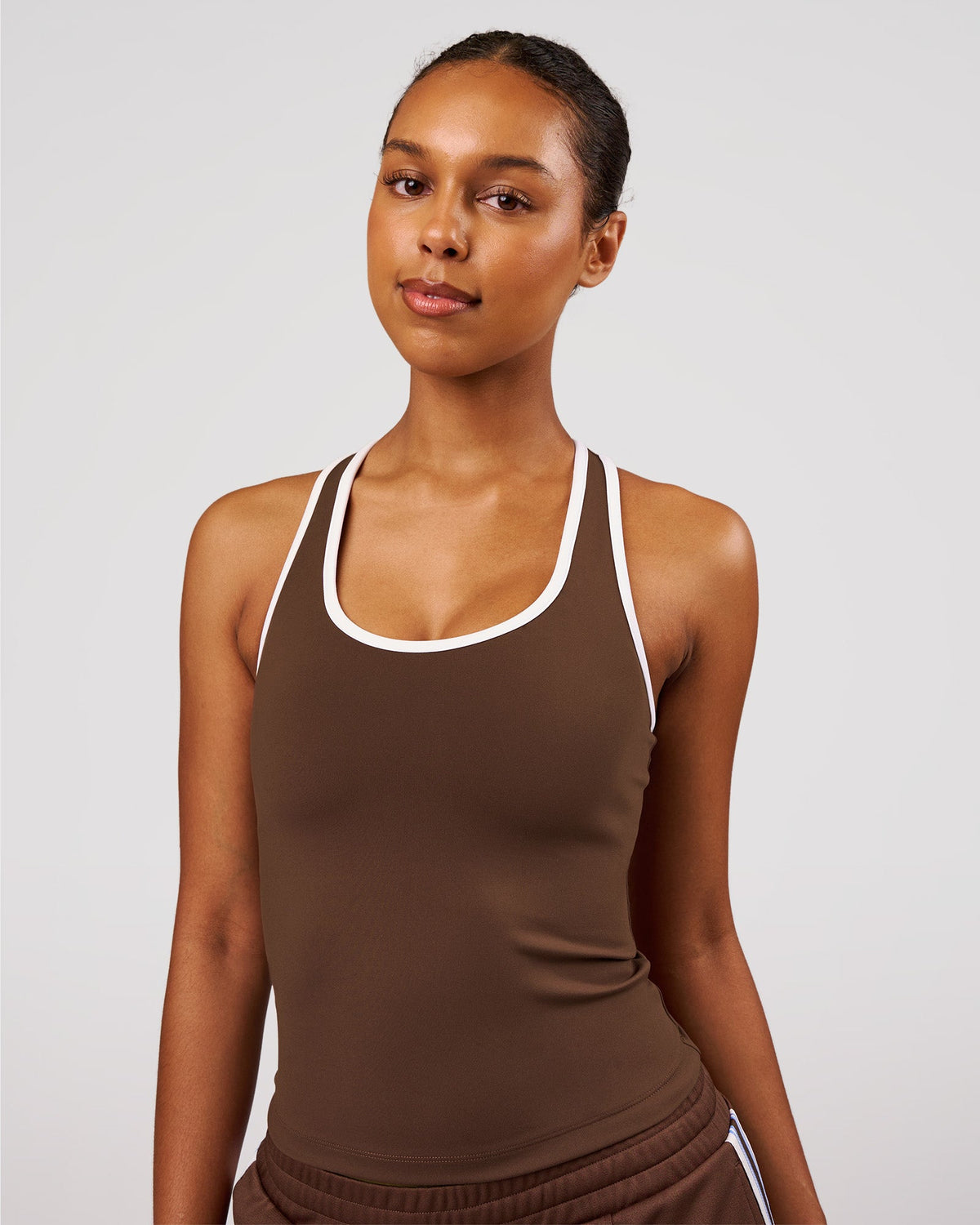 Woman wearing Flow Rep Scoop Neck Tank - Hot Chocolate-White | Model:Jordan | Size:XS