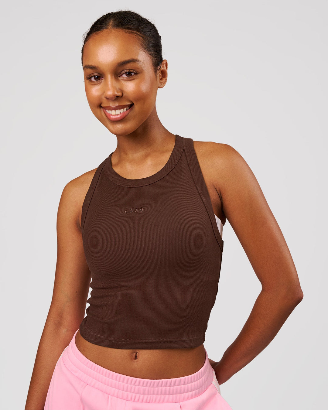 Woman wearing Go-To FLXCotton Rib Crop Tank - Hot Chocolate | Model:Jordan | Size:XS - view 1