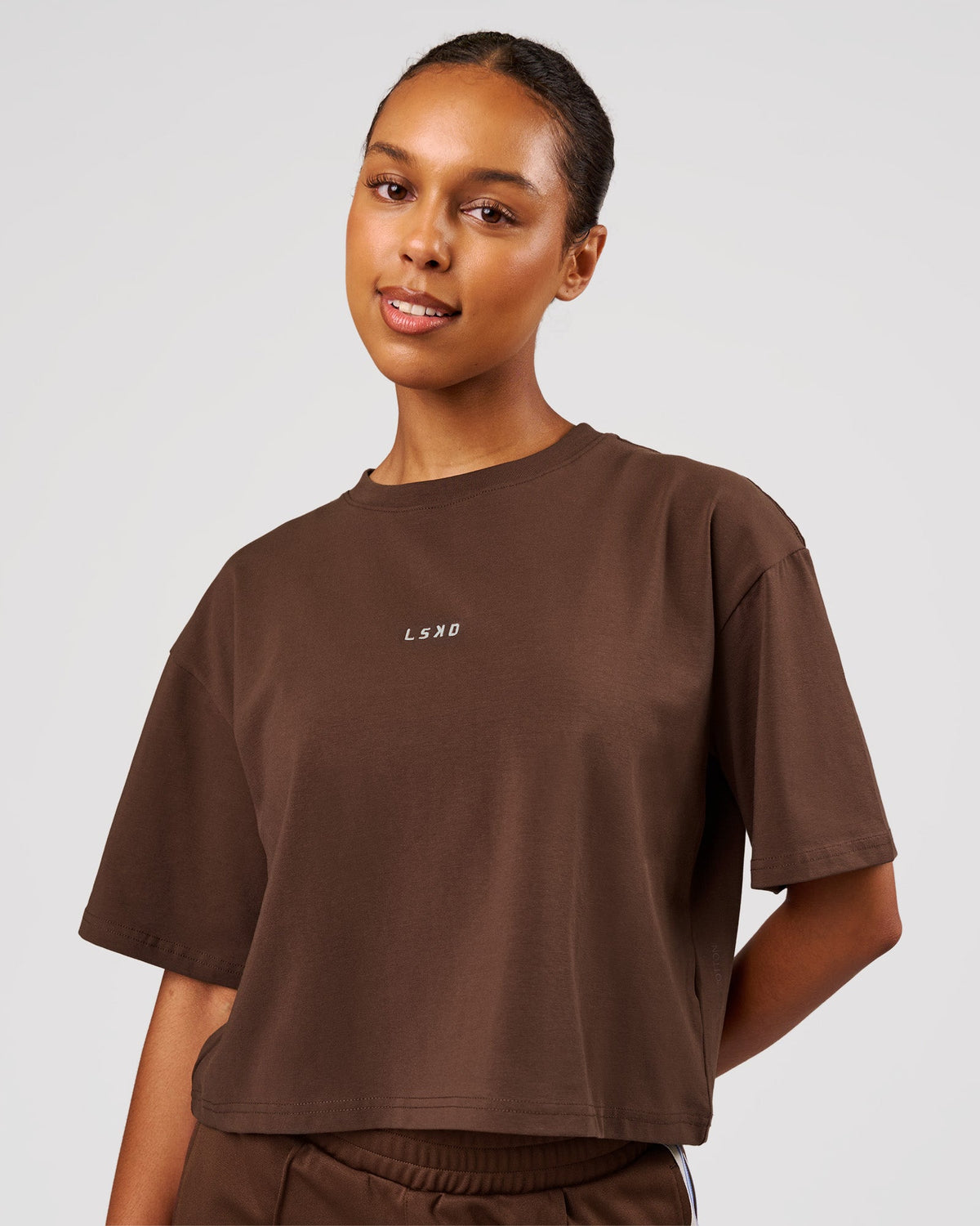 Woman wearing Go-To Heavyweight FlxCotton Skimmer Tee - Hot Chocolate-White | Model:Jordan | Size:XS