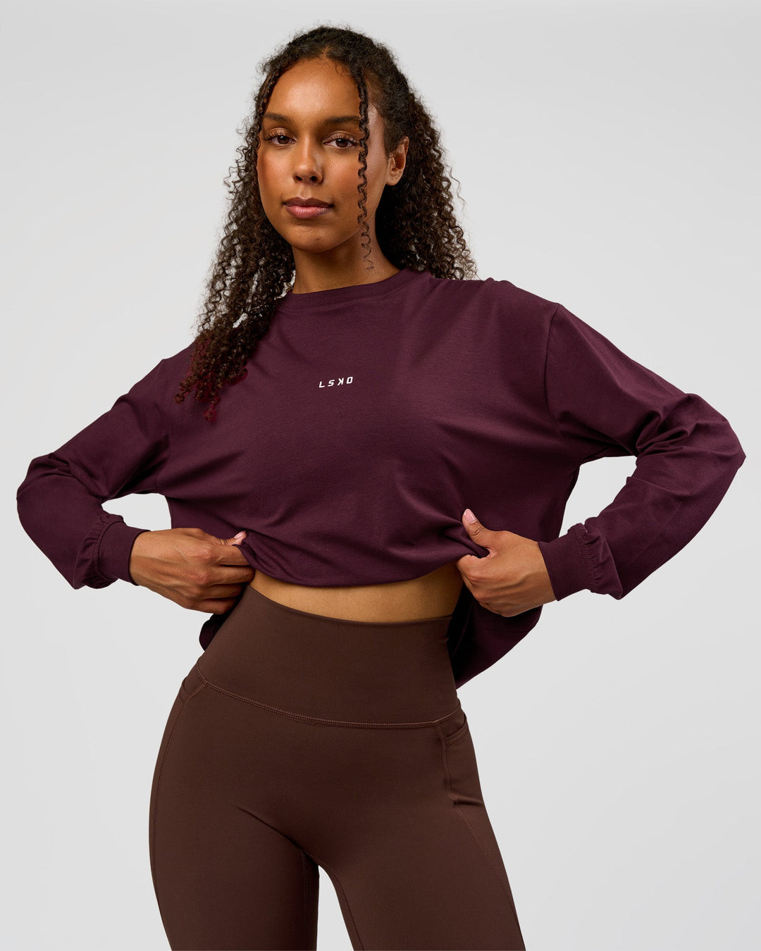 Woman wearing Go-To Long Sleeve FLXCotton Oversized Tee - Cherry Lacquer-White | Model:Jordan | Size:XS - view 1
