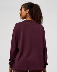 Woman wearing Go-To Long Sleeve FLXCotton Oversized Tee - Cherry Lacquer-White | Model:Jordan | Size:XS | Thumbnail Index: 2