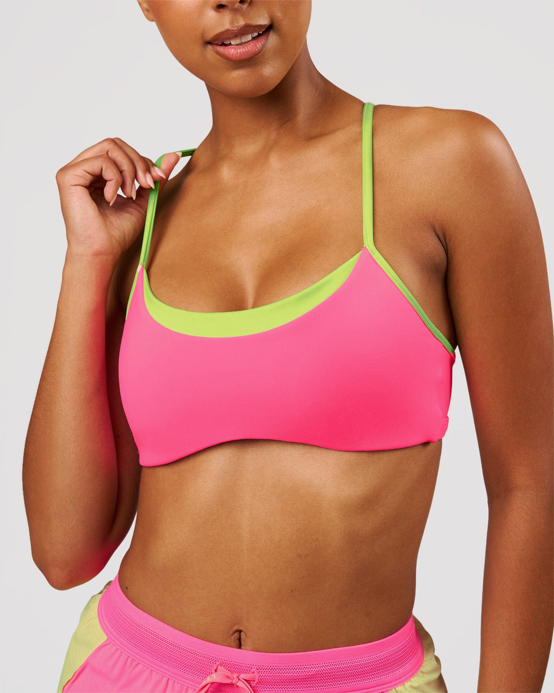 Woman wearing Tempo Sports Bra - Sugar Plum-Lime Glo | Model:Jordan | Size:XS - view 1