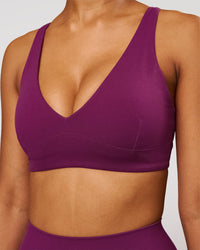Woman wearing Vitality Sports Bra - Plum Caspia | Model:Jordan | Size:XS | Thumbnail Index: 0
