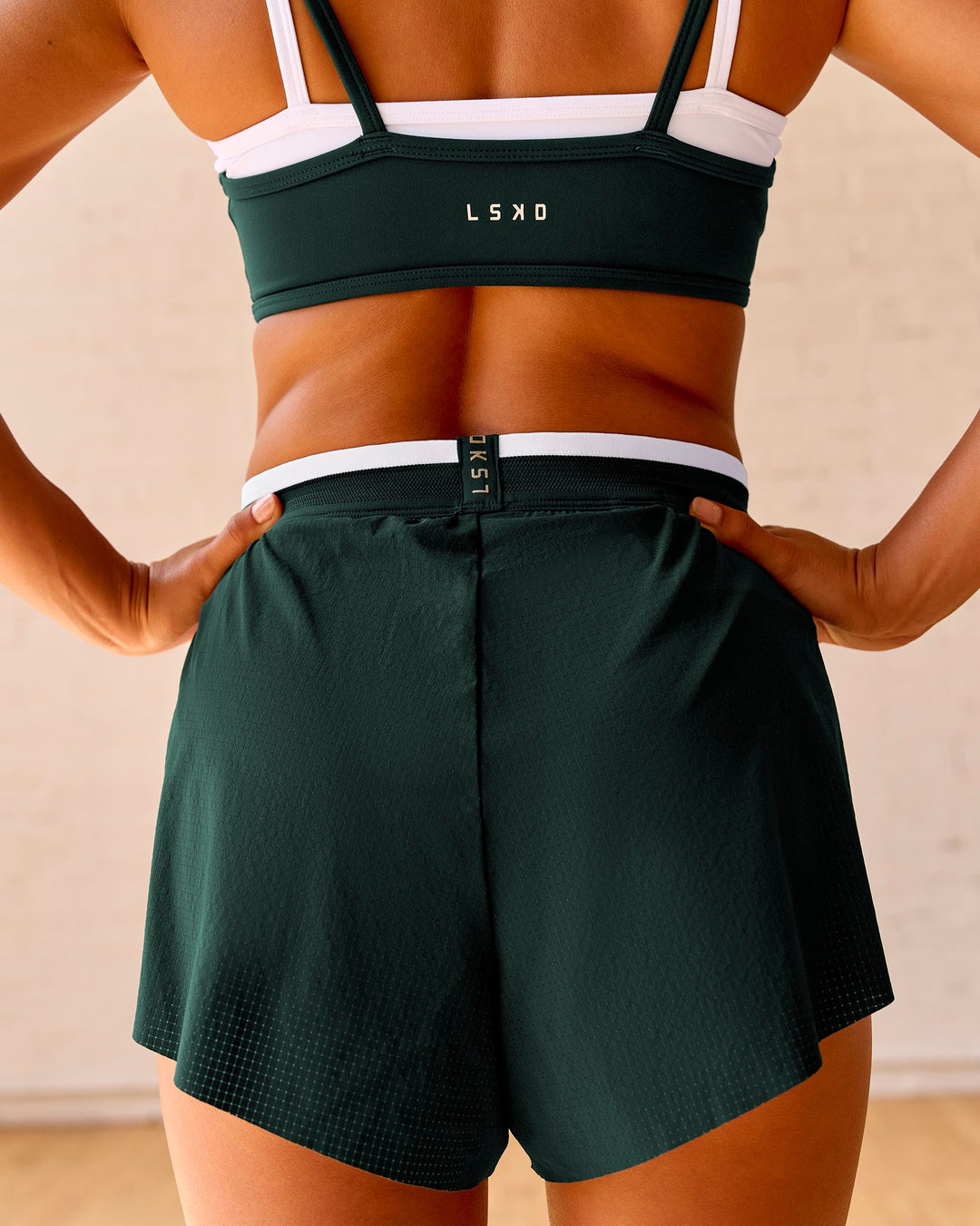 Woman wearing Trackline Accelerate 3" High-Rise Running Short - Midnight Green-White | Model:Meg | Size:XS - view 4