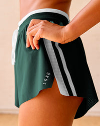 Woman wearing Trackline Accelerate 3" High-Rise Running Short - Midnight Green-White | Model:Meg | Size:XS | Thumbnail Index: 5
