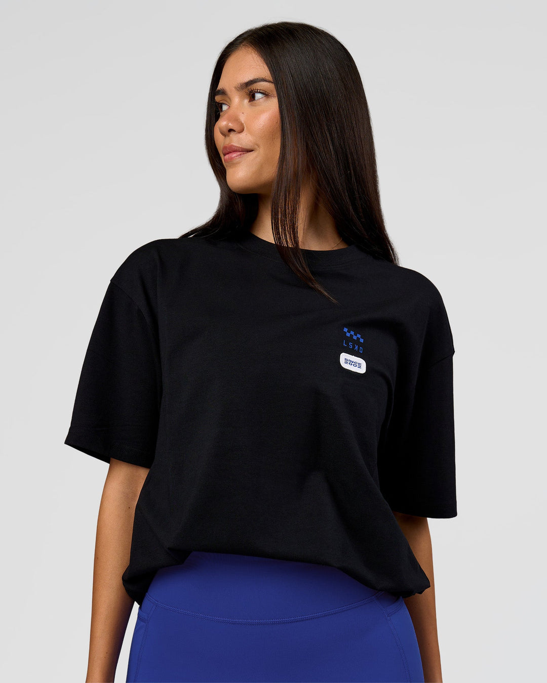 Woman wearing Archive FLXCotton Oversized Tee - Black-Electric Indigo | Model:Rhiley | Size:XS - view 5